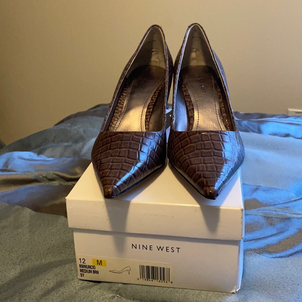 Low heel brown snakeskin pumps